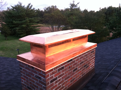 Before and after chimney cap replacement in West Hampton, NY