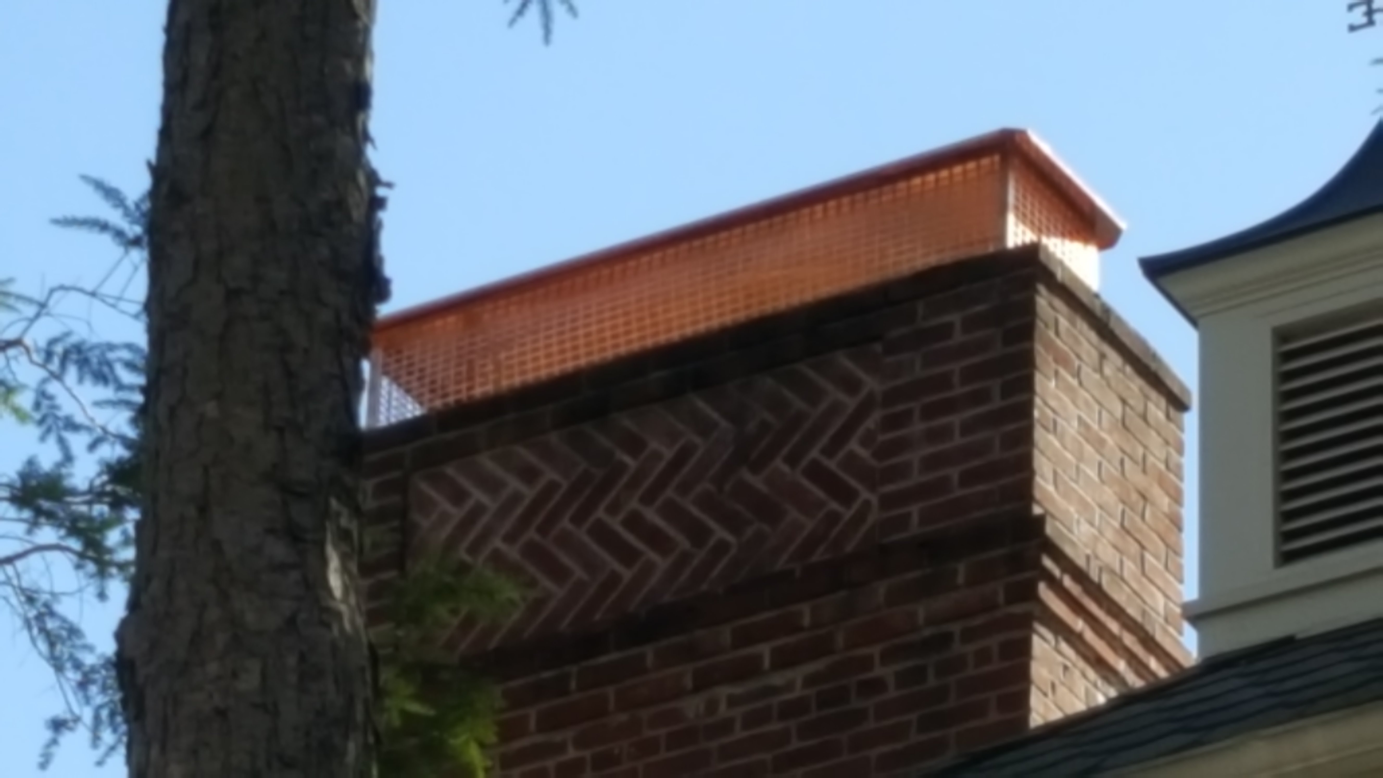 New stainless steel chimney cap installed in West Hampton, NY