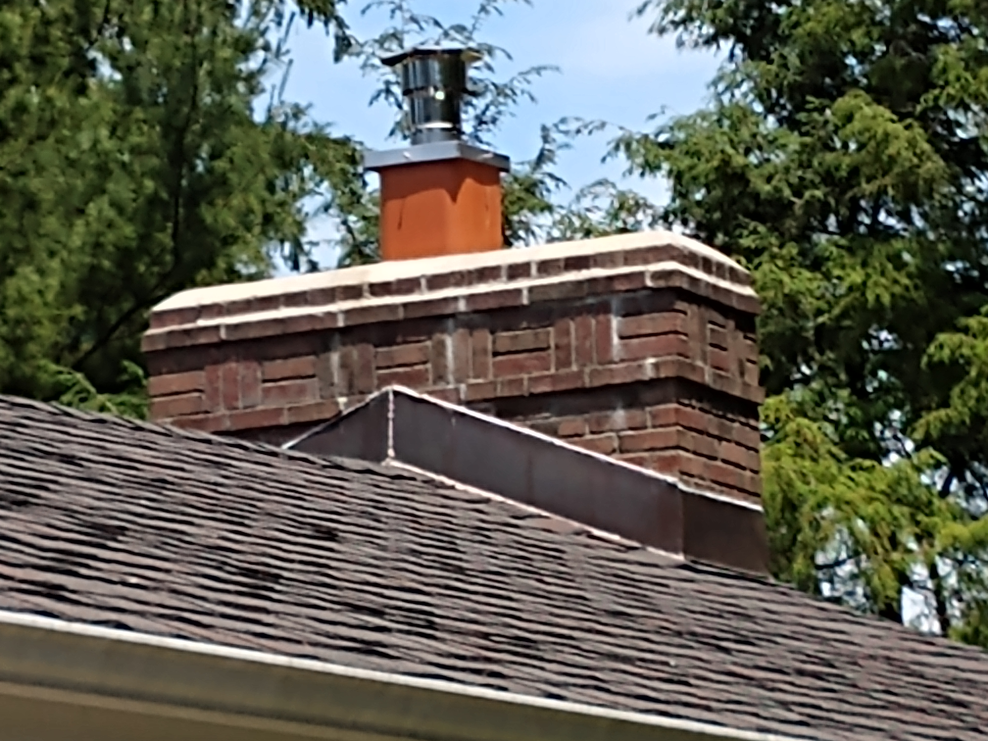 Stainless steel chimney cap with animal guard in West Hampton, New York